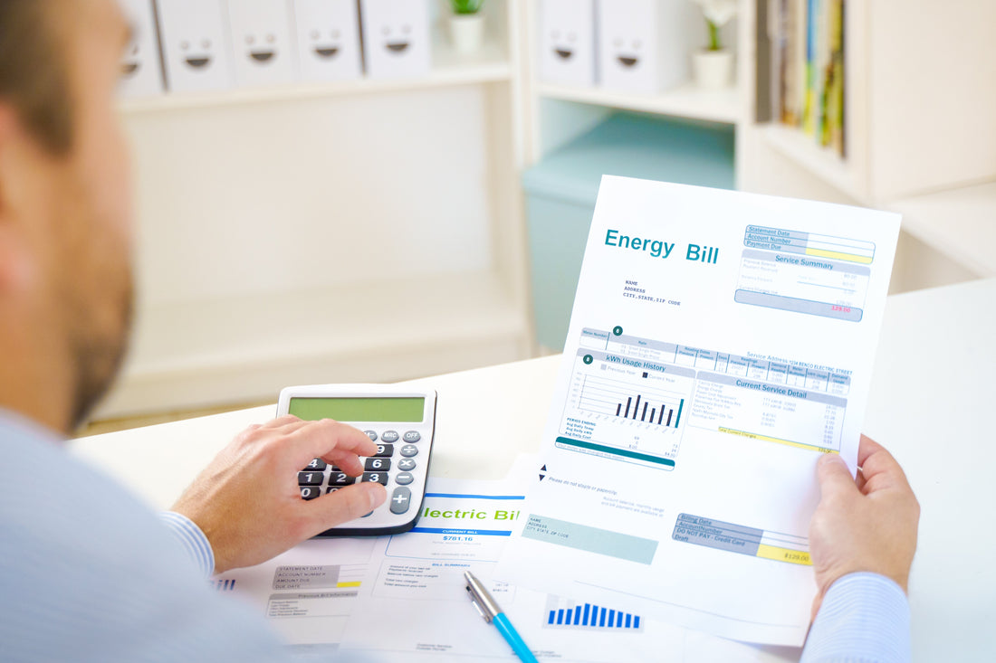 A man calculating an energy bill.