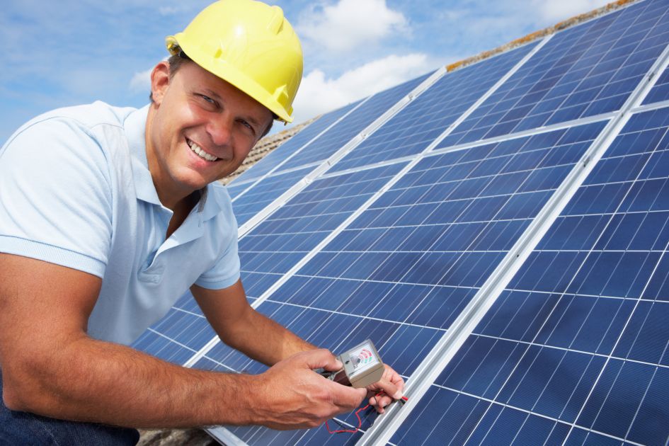 Smiling Man installing Solar Solar Panel Systems NZ