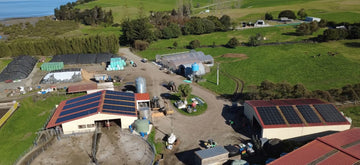 An AA Solar customer farm with solar panels installed on the roofs of its buildings
